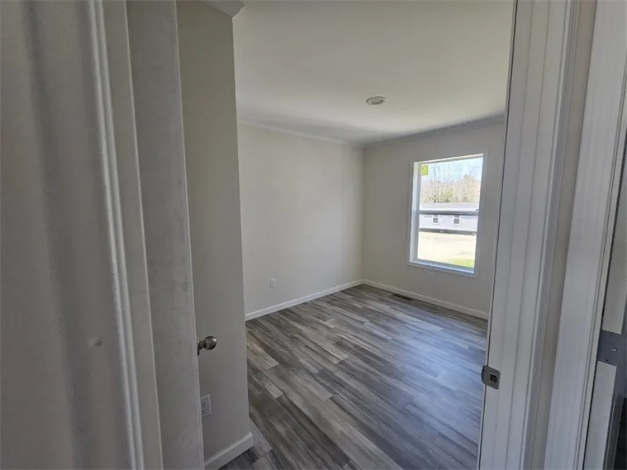 The SPINEL 64 Guest Bedroom. This Manufactured Mobile Home features 3 bedrooms and 2 baths.