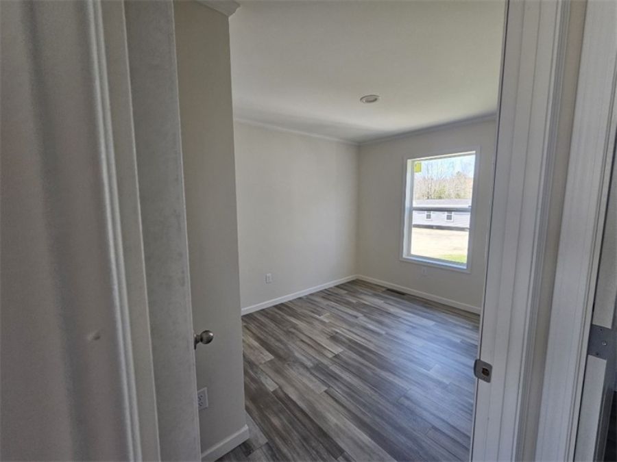 The SPINEL 64 Guest Bedroom. This Manufactured Mobile Home features 3 bedrooms and 2 baths.