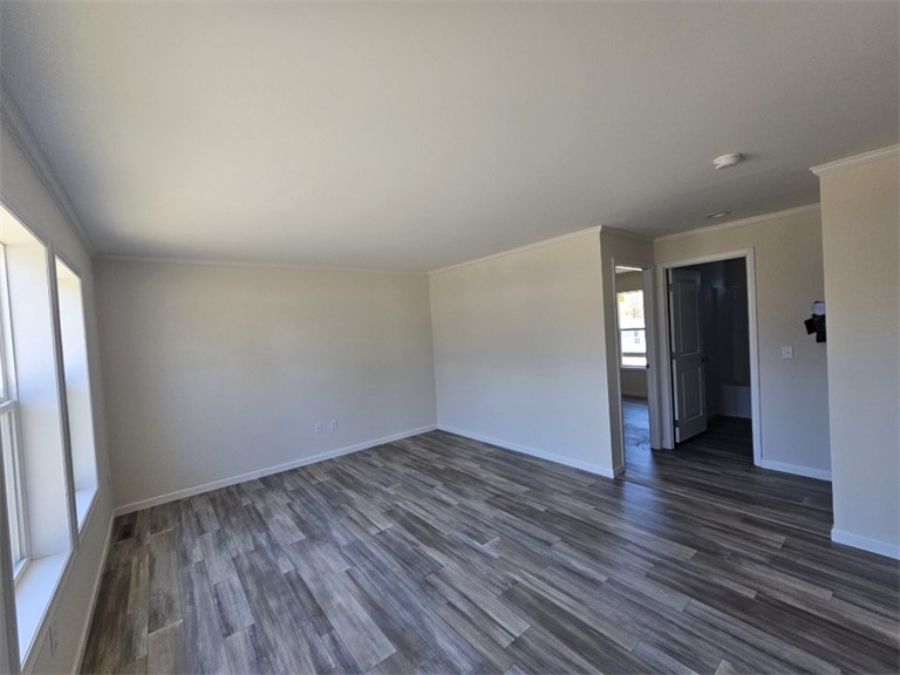 The SPINEL 64 Family Room. This Manufactured Mobile Home features 3 bedrooms and 2 baths.