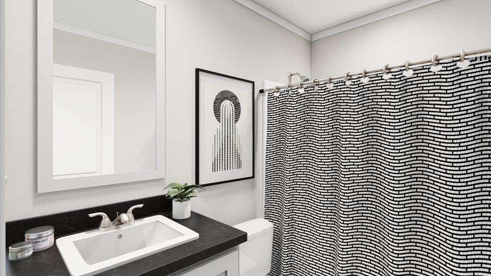 The HERE COMES THE SUN Guest Bathroom. This Manufactured Mobile Home features 3 bedrooms and 2 baths.