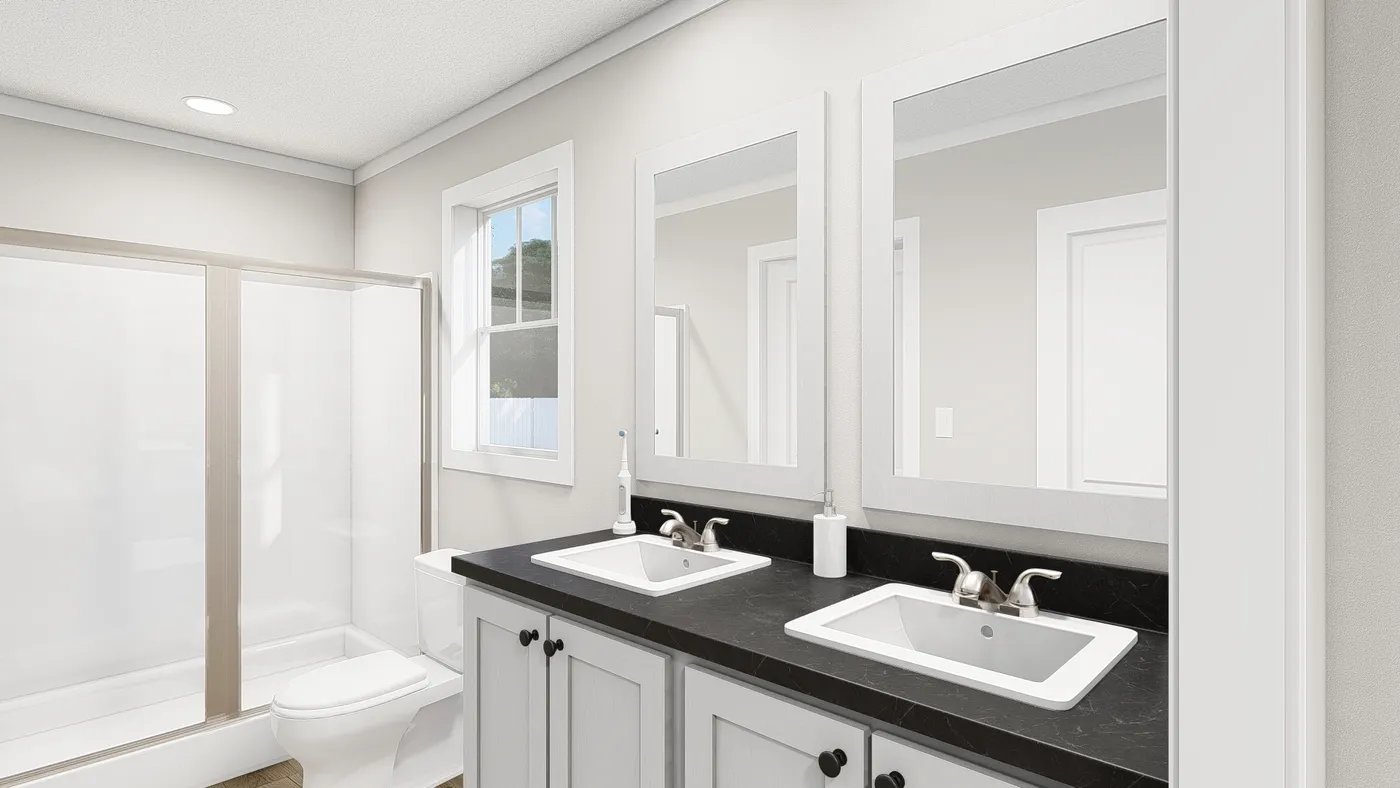 The HERE COMES THE SUN Primary Bathroom. This Manufactured Mobile Home features 3 bedrooms and 2 baths.