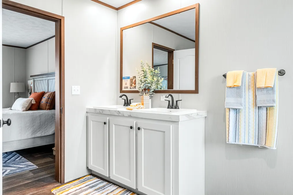 The ABSOLUTE VALUE Primary Bathroom. This Manufactured Mobile Home features 4 bedrooms and 2 baths.