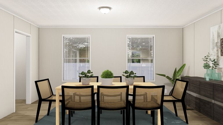 The THE RESERVE 76 Dining Area. This Manufactured Mobile Home features 4 bedrooms and 2 baths.