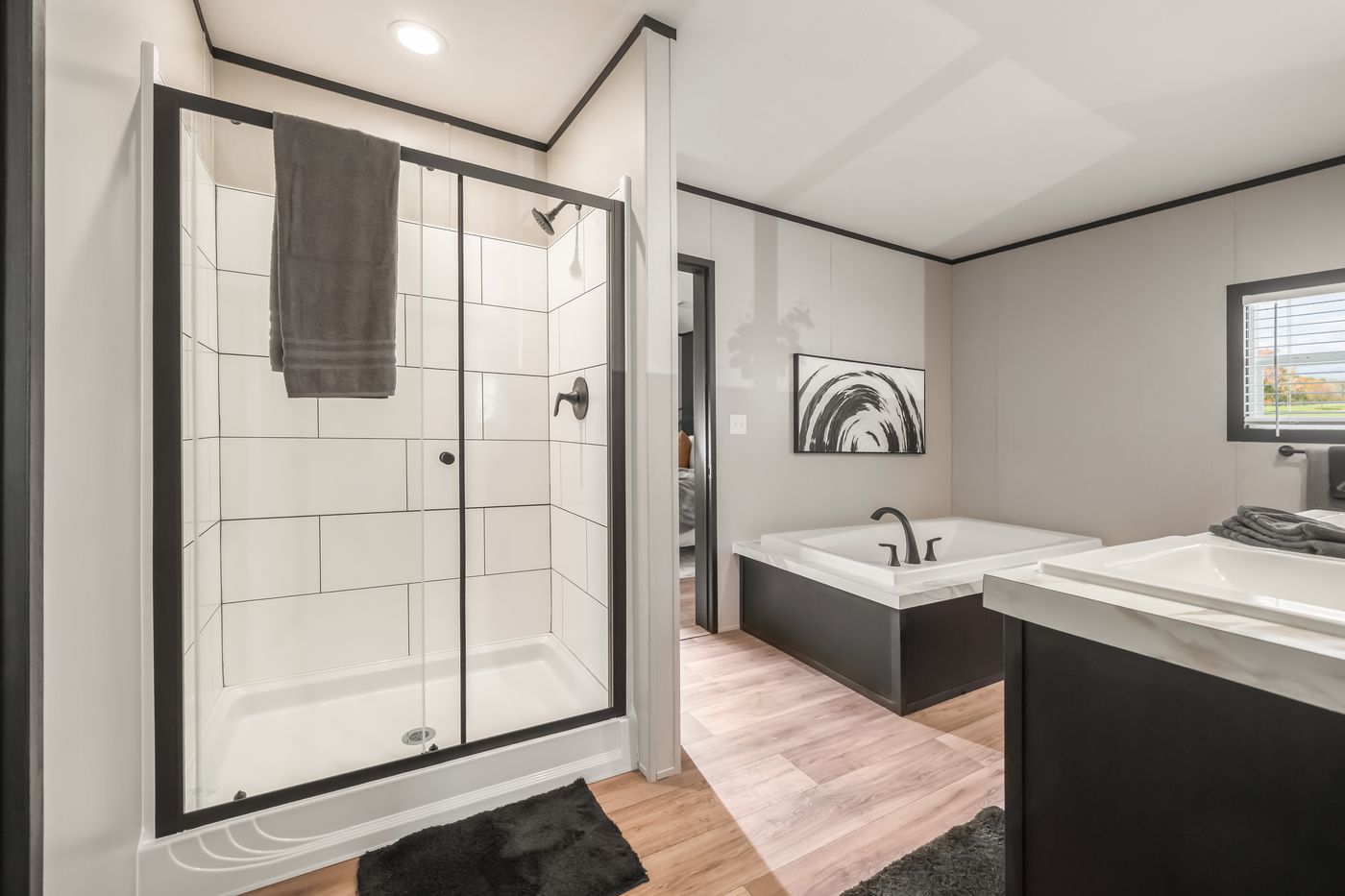 The THE ANNIVERSARY 2.1 Primary Bathroom. This Manufactured Mobile Home features 3 bedrooms and 2 baths.