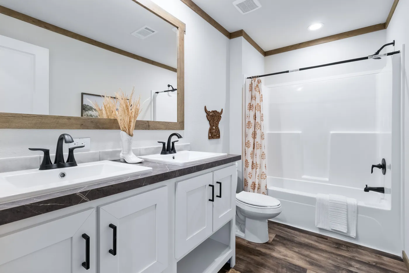 The SAWYER ELITE Guest Bathroom. This Manufactured Mobile Home features 3 bedrooms and 2 baths.