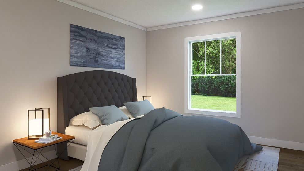The BORN TO RUN Primary Bedroom. This Manufactured Mobile Home features 2 bedrooms and 2 baths.