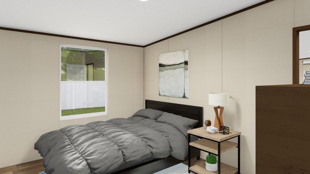 The SATISFACTION Guest Bedroom. This Manufactured Mobile Home features 3 bedrooms and 2 baths.