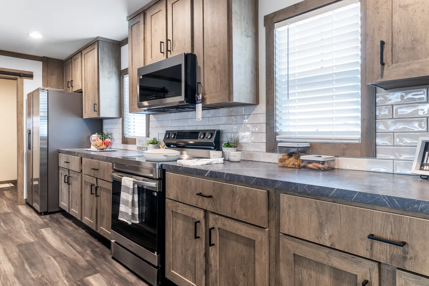 The ISABELLA ELITE Living Room. This Manufactured Mobile Home features 3 bedrooms and 2 baths.