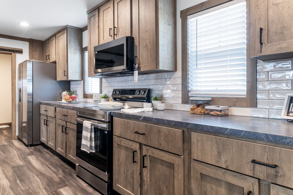 The ISABELLA ELITE Living Room. This Manufactured Mobile Home features 3 bedrooms and 2 baths.
