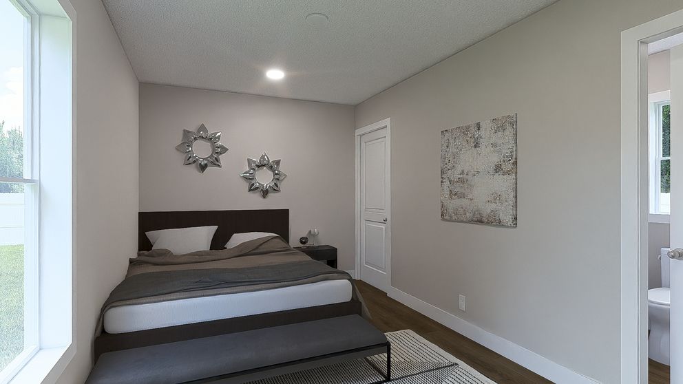 The YESTERDAY Primary Bedroom. This Manufactured Mobile Home features 1 bedroom and 1 bath.