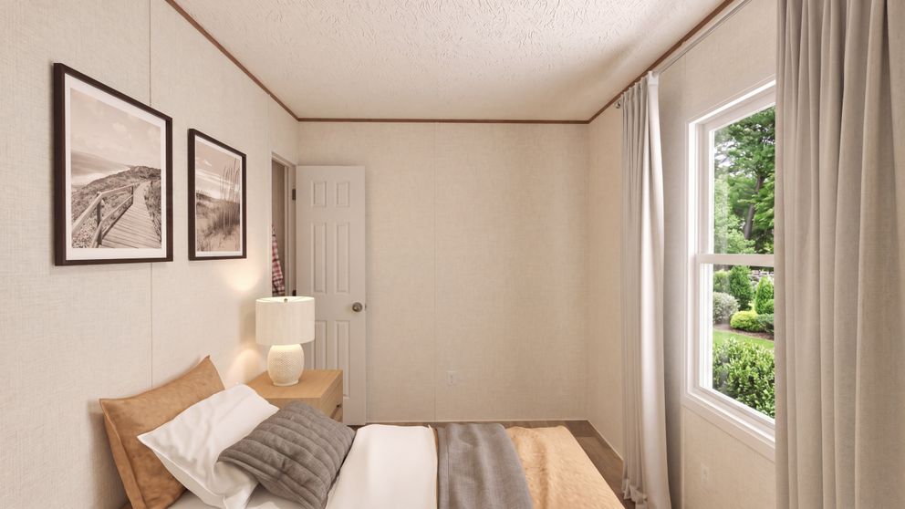 The HICKORY Guest Bedroom. This Manufactured Mobile Home features 3 bedrooms and 2 baths.