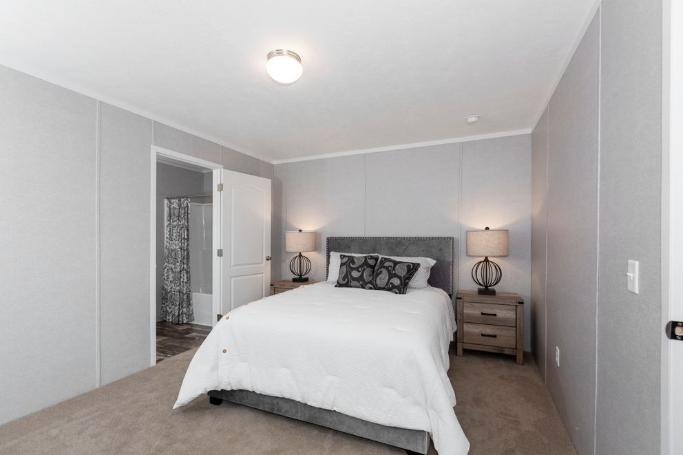 The SAPPHIRE Primary Bedroom. This Manufactured Mobile Home features 3 bedrooms and 2 baths.