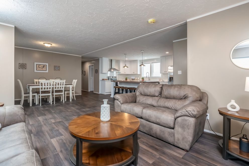 The ISLAND BREEZE 64 Living Room. This Manufactured Mobile Home features 4 bedrooms and 2 baths.