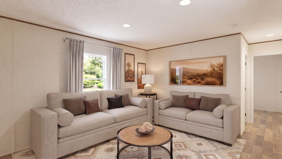 The DOGWOOD Living Room. This Manufactured Mobile Home features 2 bedrooms and 2 baths.