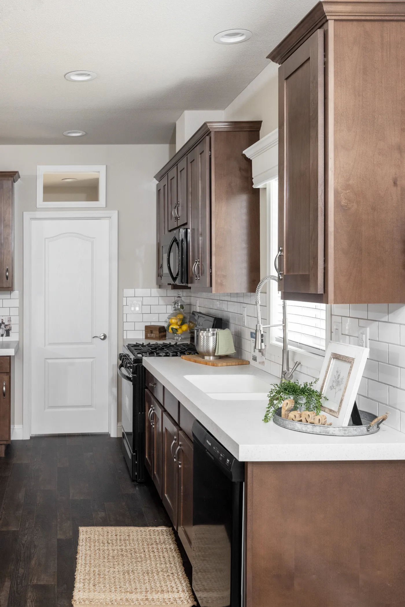 The FAIRPOINT 24523K Kitchen. This Manufactured Mobile Home features 3 bedrooms and 2 baths.