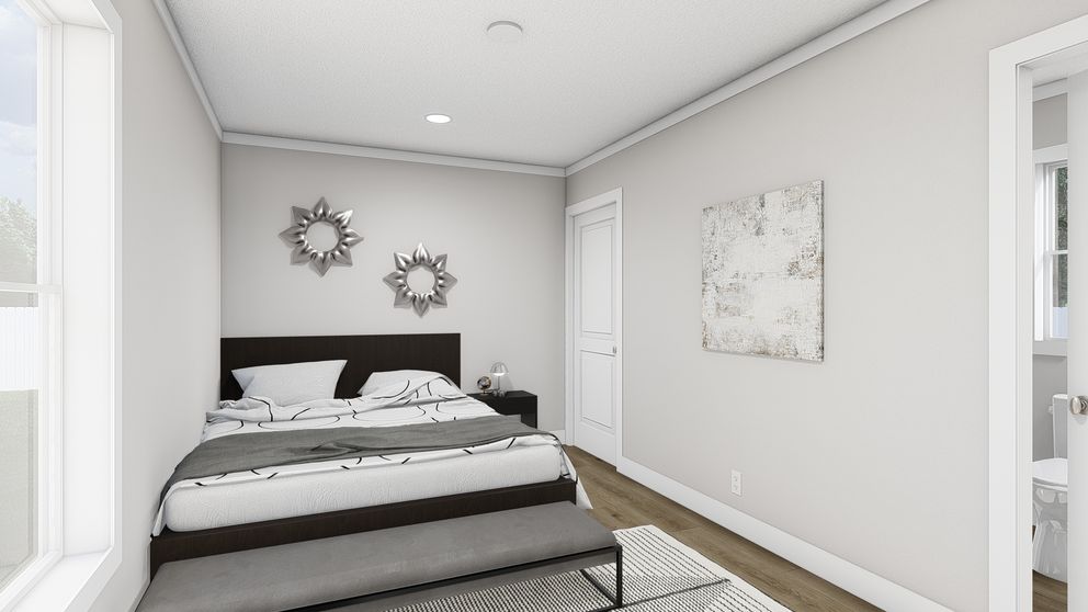 The YESTERDAY Primary Bedroom. This Manufactured Mobile Home features 1 bedroom and 1 bath.