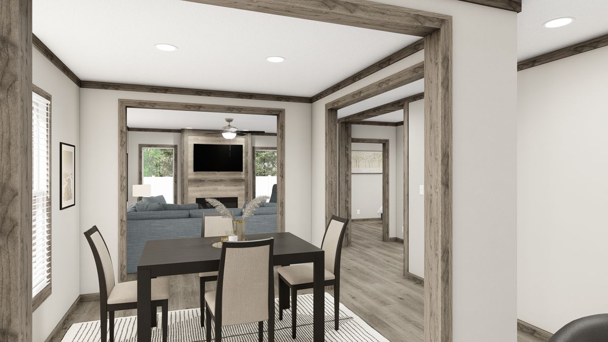 The THE MADISON Dining Room. This Manufactured Mobile Home features 3 bedrooms and 2 baths.