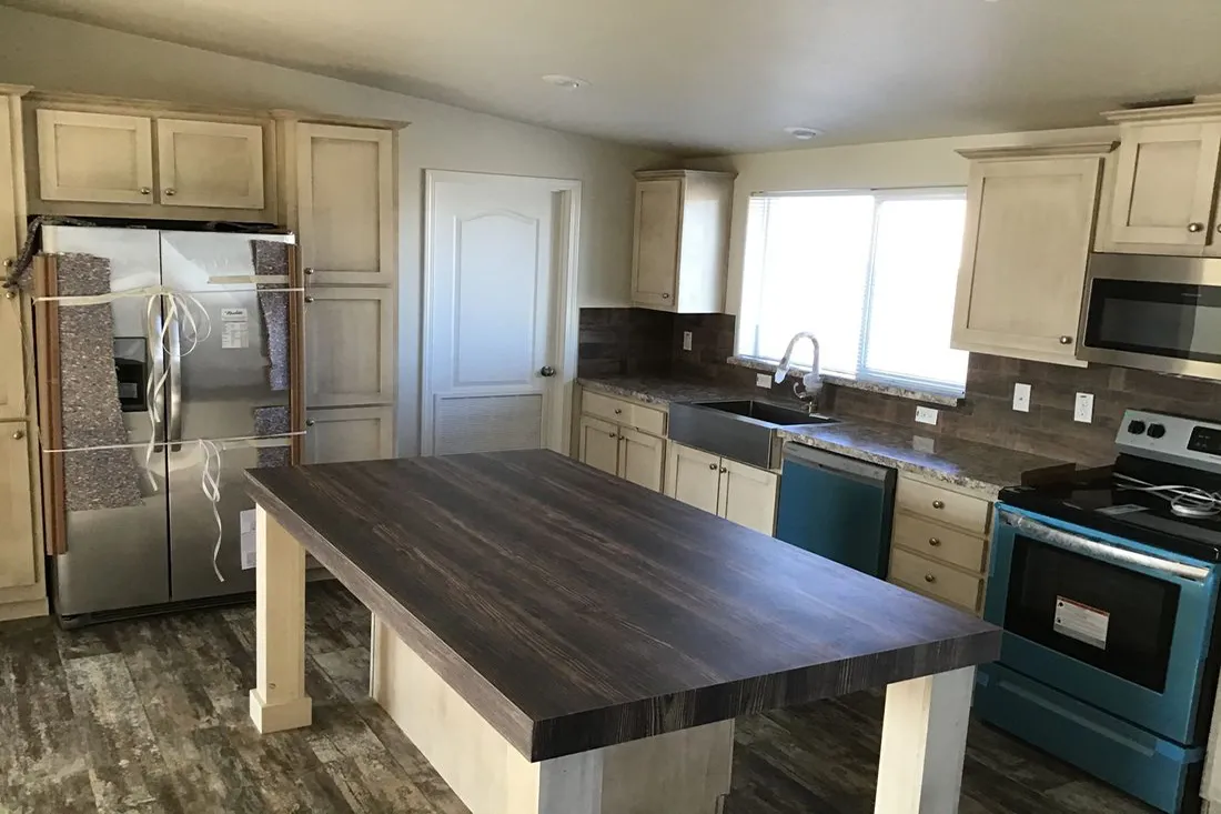 The 2022 COLUMBIA RIVER (NEW) Kitchen. This Manufactured Mobile Home features 3 bedrooms and 2 baths.