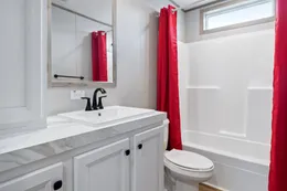 The THE REAL DEAL Guest Bathroom. This Manufactured Mobile Home features 3 bedrooms and 2 baths.