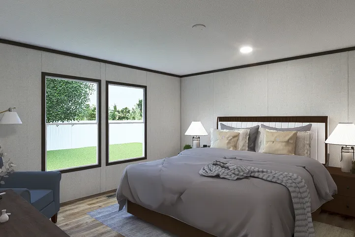 The EMPOWER Primary Bedroom. This Manufactured Mobile Home features 4 bedrooms and 2 baths.