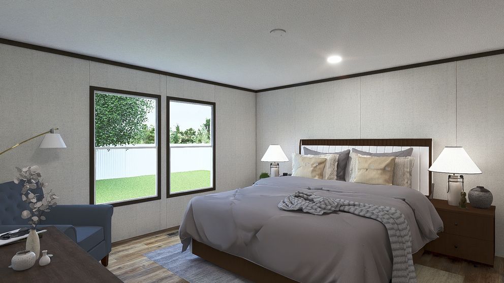 The EMPOWER Primary Bedroom. This Manufactured Mobile Home features 4 bedrooms and 2 baths.