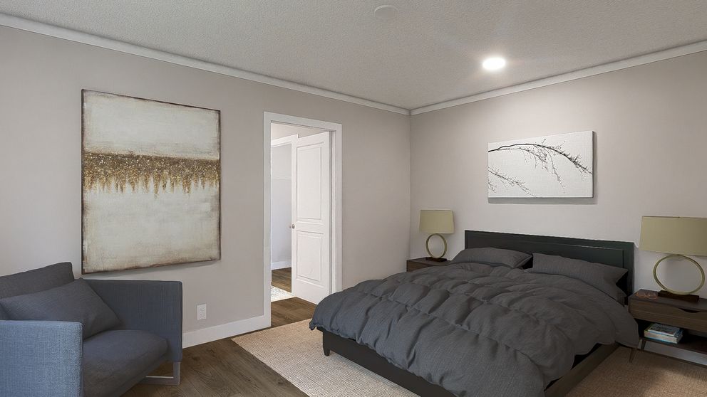 The SWEET CAROLINE Primary Bedroom. This Manufactured Mobile Home features 3 bedrooms and 2 baths.