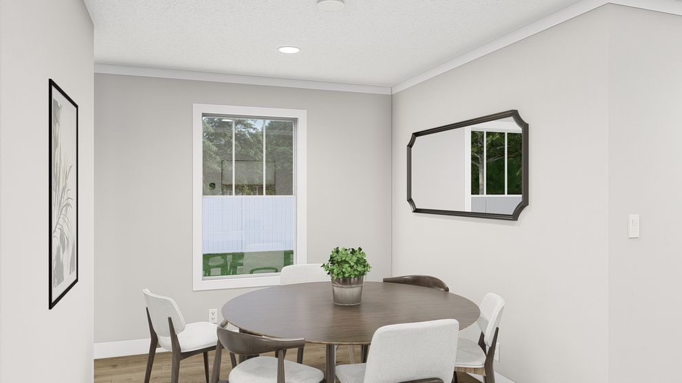 The BROWN EYED GIRL Dining Room. This Manufactured Mobile Home features 4 bedrooms and 2 baths.