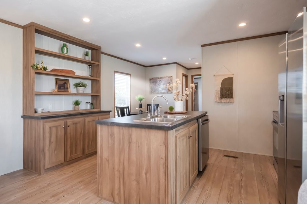 The SEAS THE DAY Kitchen. This Manufactured Mobile Home features 3 bedrooms and 2 baths.