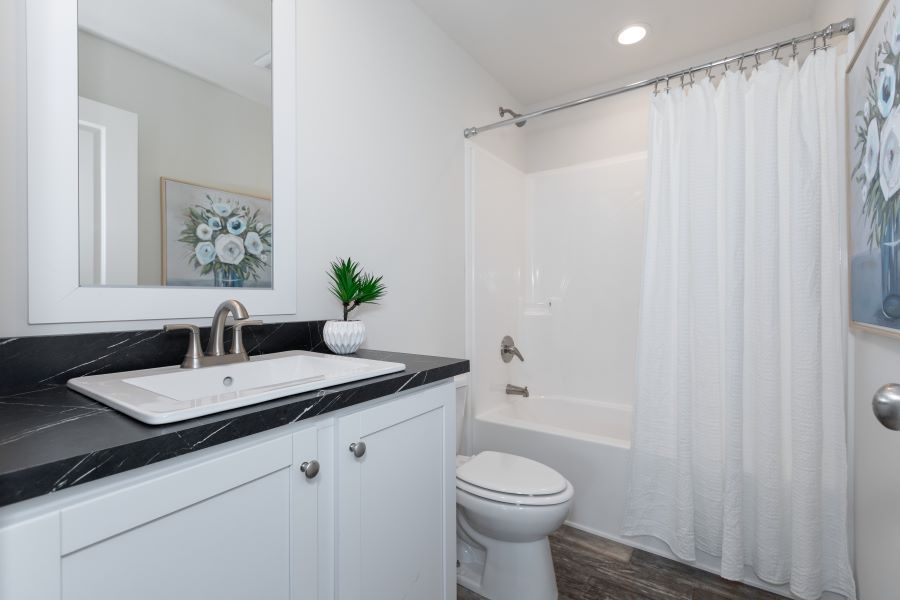 The HORIZON/4428-MS057 SECT Guest Bathroom. This Manufactured Mobile Home features 3 bedrooms and 2 baths.