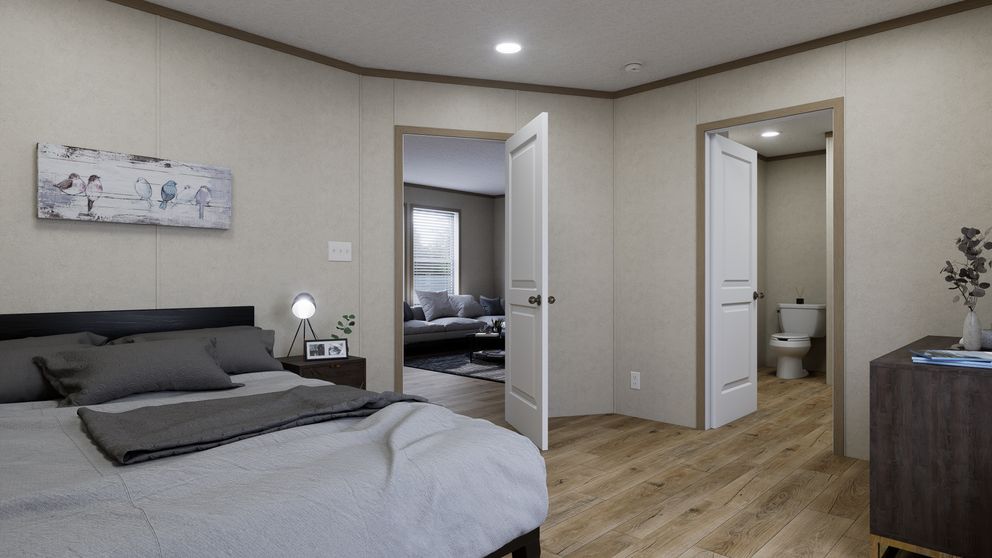 The 4824-CC54 OAKSTEAD 48 Primary Bedroom. This Manufactured Mobile Home features 3 bedrooms and 2 baths.