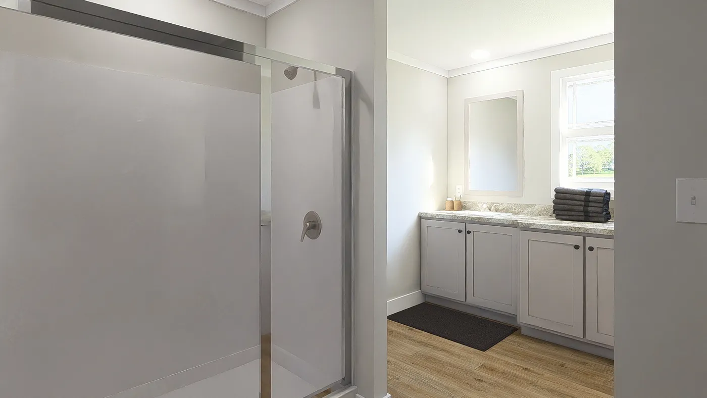 The THE BREEZE 64 Primary Bathroom. This Manufactured Mobile Home features 4 bedrooms and 2 baths.