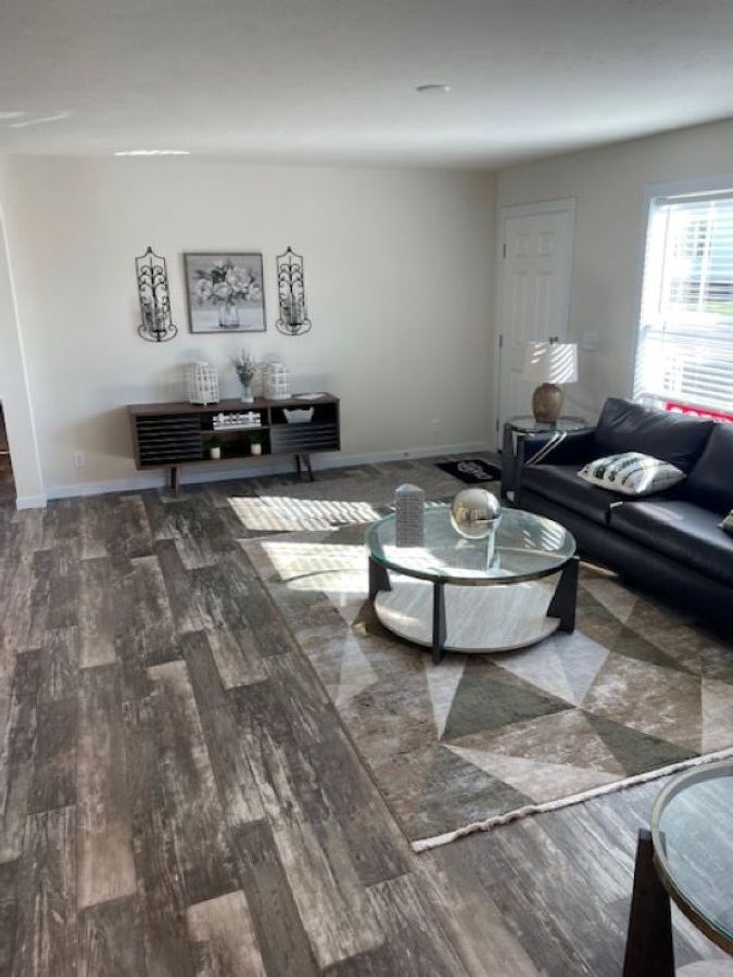 The AURORA PLACE 5228-MS049-1 SECT Living Room. This Manufactured Mobile Home features 3 bedrooms and 2 baths.