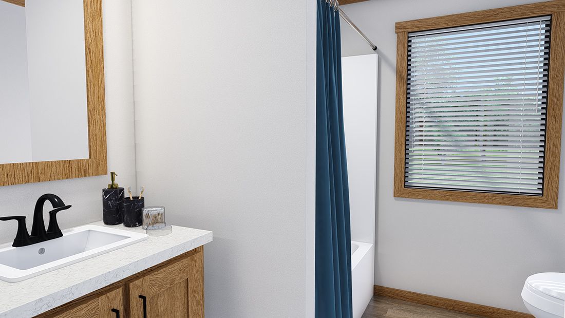 The TINSLEY Guest Bathroom. This Manufactured Mobile Home features 4 bedrooms and 2 baths.