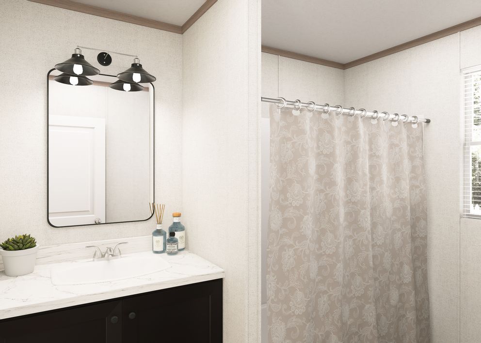 The THE RESERVE 60 Guest Bathroom. This Manufactured Mobile Home features 3 bedrooms and 2 baths.