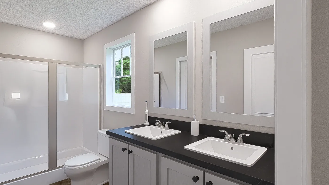 The HERE COMES THE SUN Primary Bathroom. This Manufactured Mobile Home features 3 bedrooms and 2 baths.