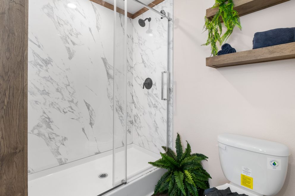 The FARM 4 FLEX Primary Bathroom. This Manufactured Mobile Home features 4 bedrooms and 3 baths.