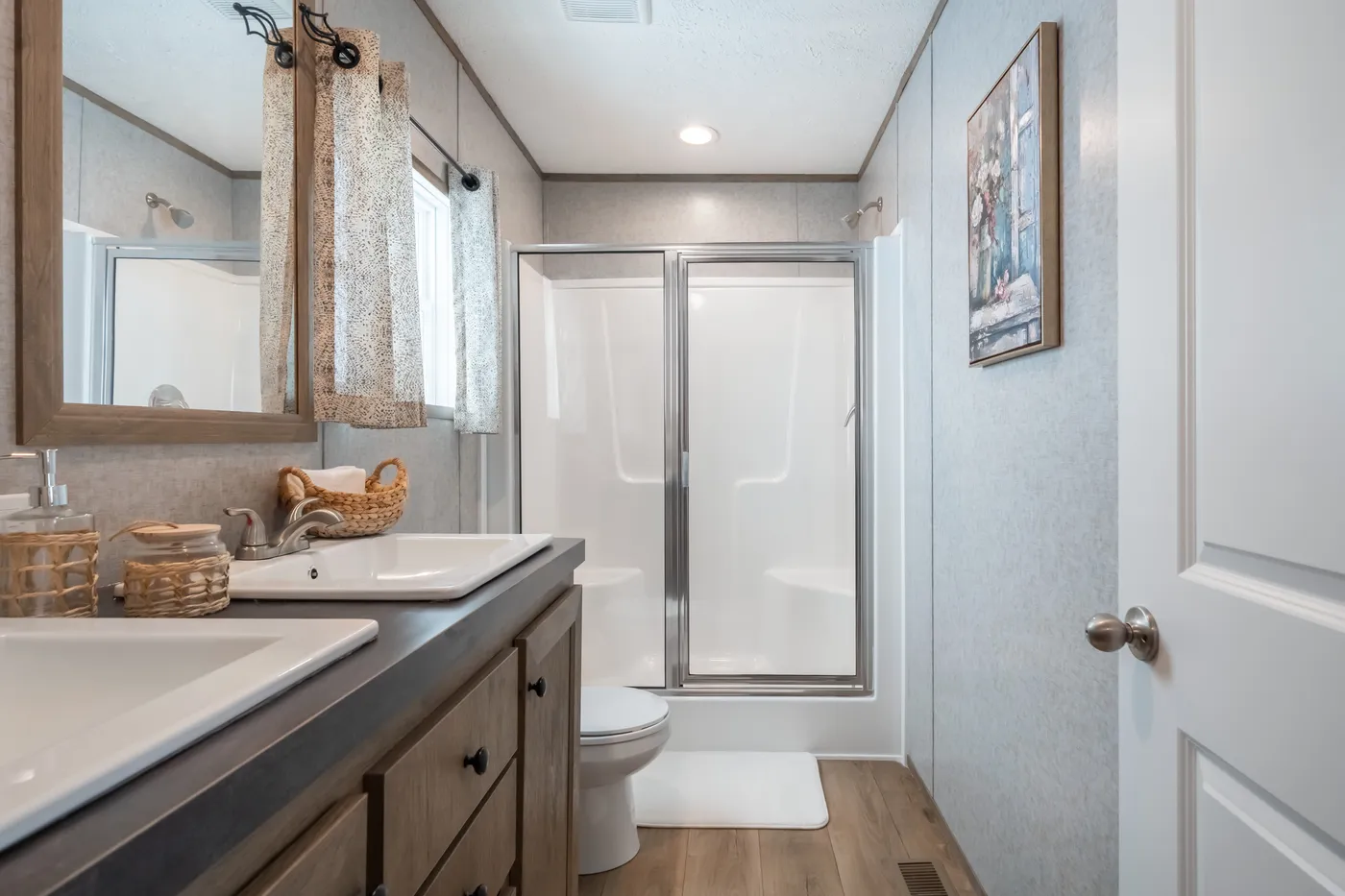The WARRIOR II Primary Bathroom. This Manufactured Mobile Home features 2 bedrooms and 2 baths.