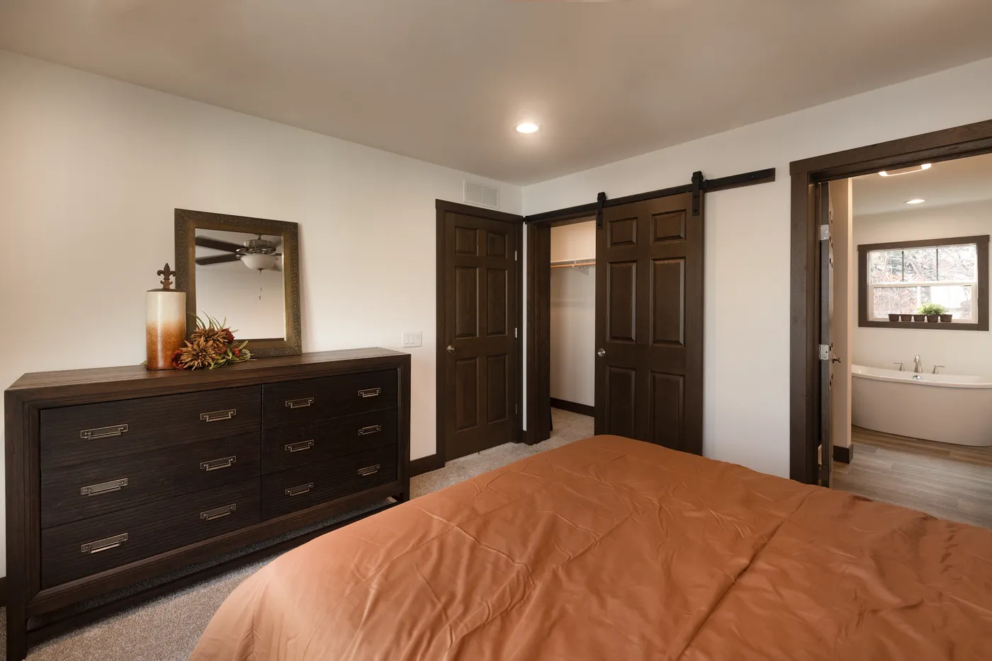 The LEGEND 78 Primary Bedroom. This Manufactured Mobile Home features 3 bedrooms and 2 baths.