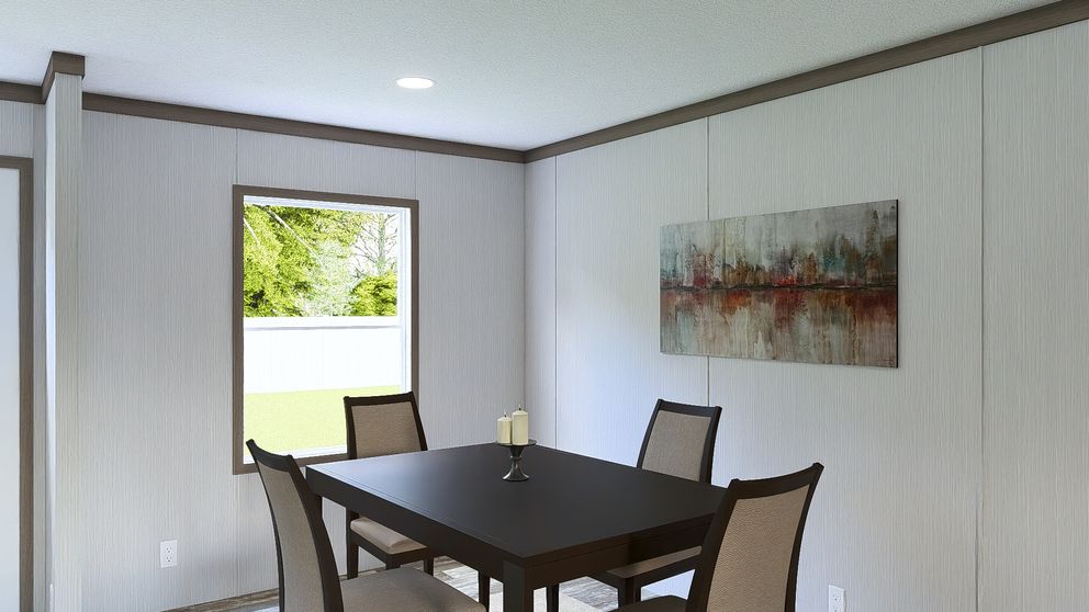 The ULTRA ISLAND BREEZE 56' Dining Area. This Manufactured Mobile Home features 3 bedrooms and 2 baths.