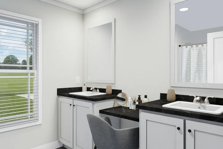 The THE BREEZE Guest Bathroom. This Manufactured Mobile Home features 3 bedrooms and 2 baths.