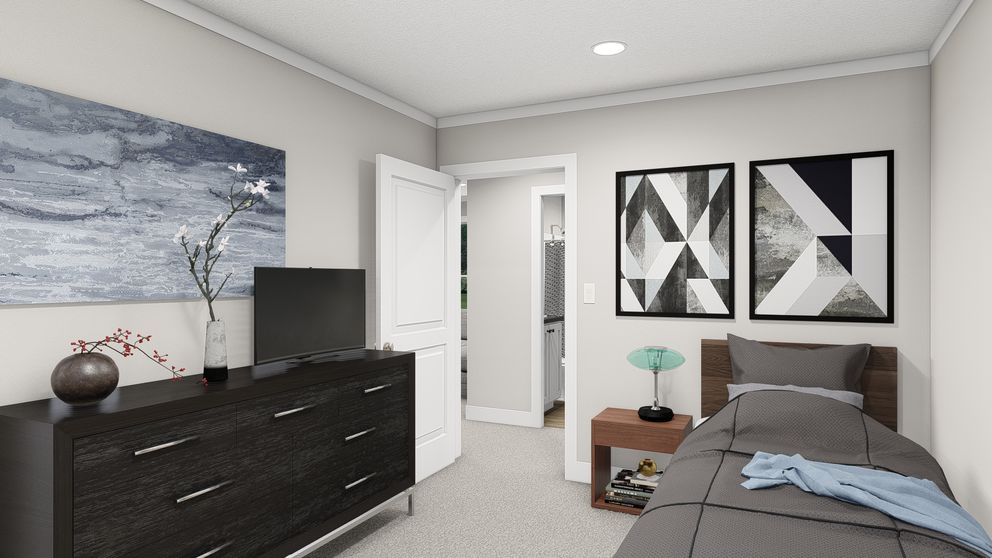 The HERE COMES THE SUN Guest Bedroom. This Manufactured Mobile Home features 3 bedrooms and 2 baths.