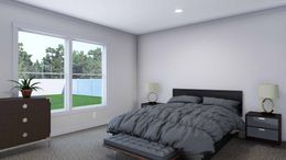 The YELLOW SUBMARINE Primary Bedroom. This Manufactured Mobile Home features 5 bedrooms and 2 baths.