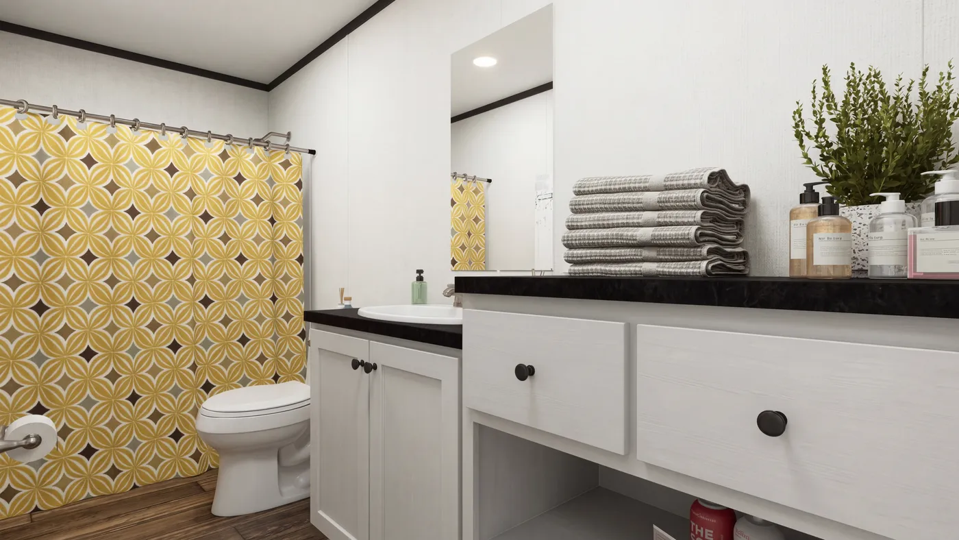 The THE MOUNTAINEER 56 Guest Bathroom. This Manufactured Mobile Home features 3 bedrooms and 2 baths.