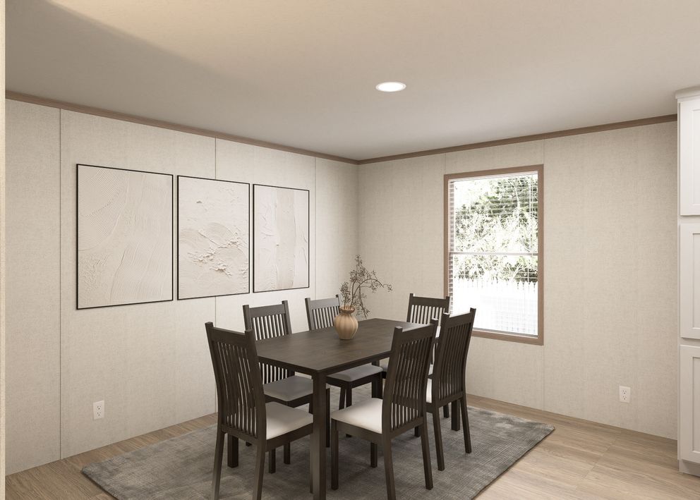 The THE RESERVE 60 Dining Area. This Manufactured Mobile Home features 3 bedrooms and 2 baths.
