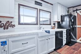 The BREEZE FARMHOUSE Kitchen. This Manufactured Mobile Home features 3 bedrooms and 2 baths.