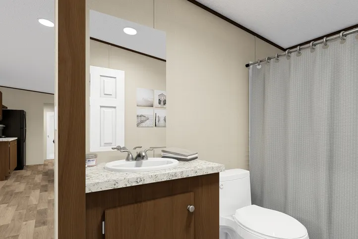 The THRILL Guest Bathroom. This Manufactured Mobile Home features 3 bedrooms and 2 baths.