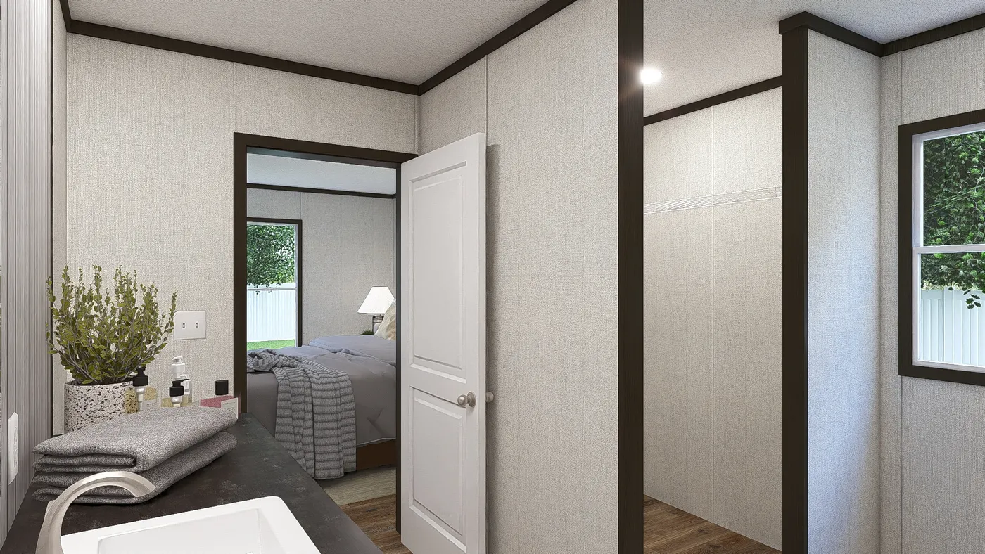 The AMBITION Primary Bathroom. This Manufactured Mobile Home features 4 bedrooms and 2 baths.