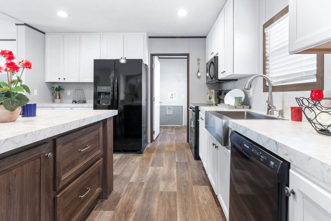 The THE SUNDOWNER Kitchen. This Manufactured Mobile Home features 3 bedrooms and 2 baths.
