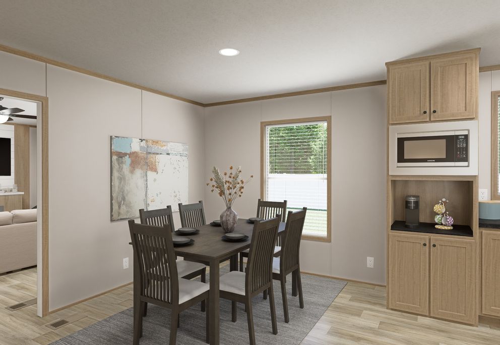 The THE MOUNTAINEER 72 Dining Area. This Manufactured Mobile Home features 3 bedrooms and 2 baths.