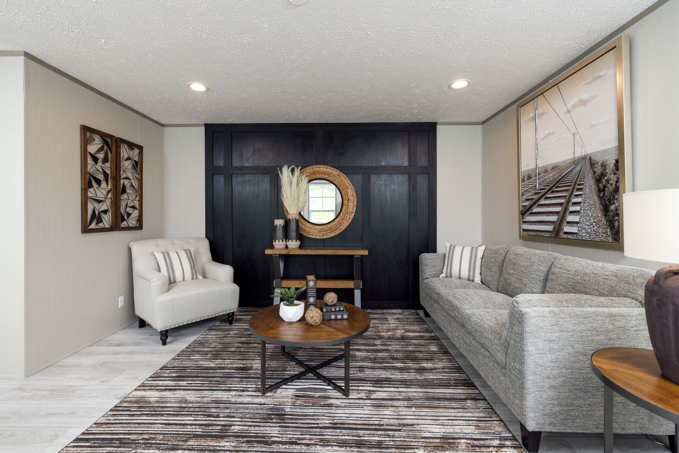 The SHOWER HOUSE Living Room. This Manufactured Mobile Home features 3 bedrooms and 2 baths.